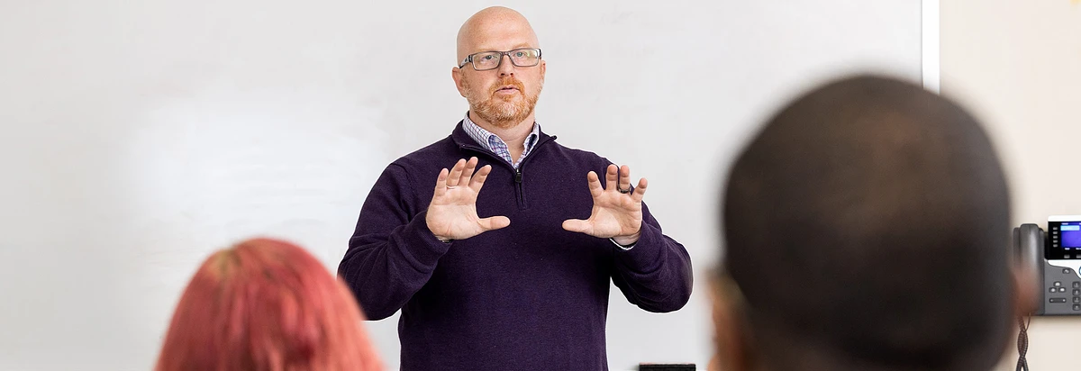 Faculty lecturing in front of students